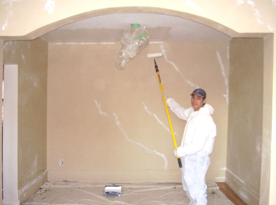 Richard Ancheta painting walls for interior painting decoration.